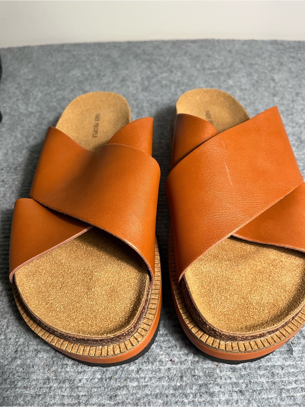 Free People Women's Crossover Leather Slide in Cognac. Very sight scratch on top